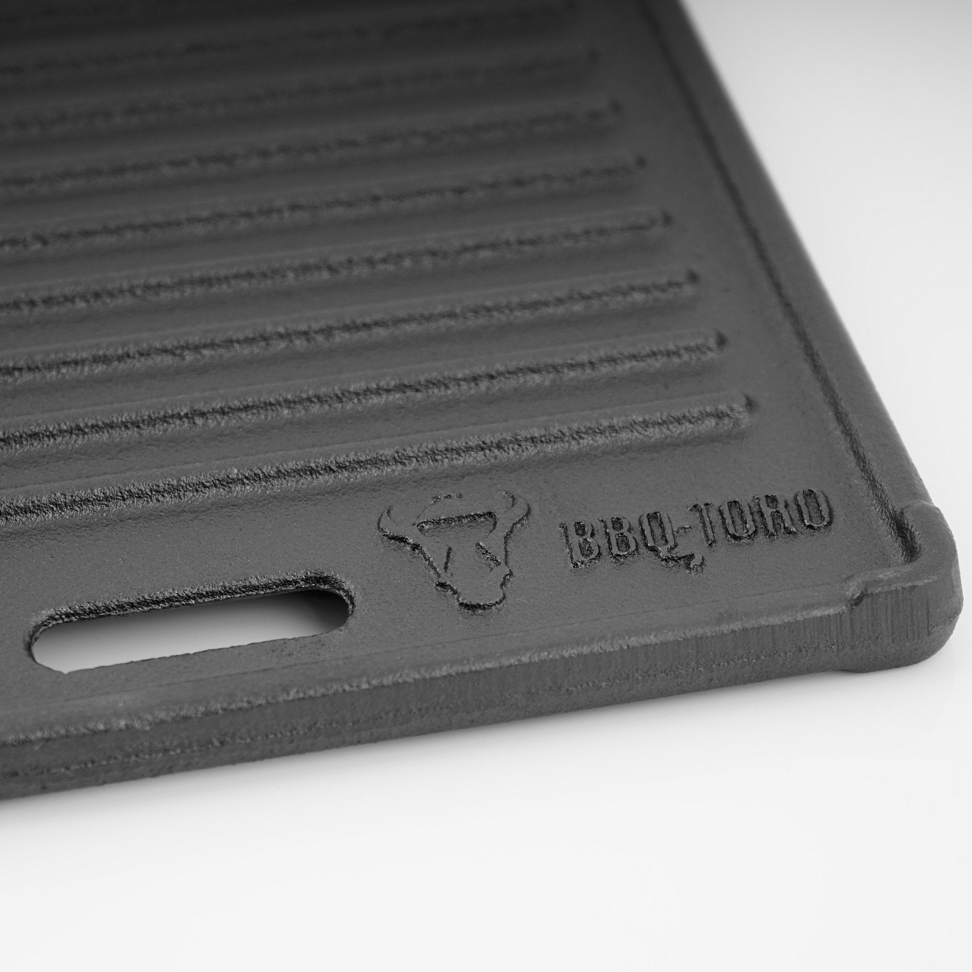 Plaque de cuisson réversible, 45 x 19,5 cm, en fonte émaillée.