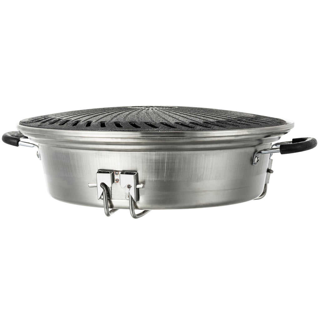 Ensemble de grilles pour poêle à fusée, comprenant une plaque de cuisson en fonte, une grille de cuisson, un bac de récupération des graisses et un lève-gril.